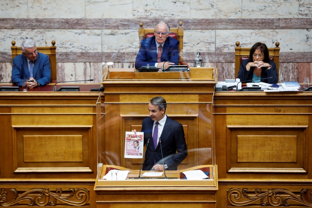 Greek Prime Minister Kyriakos Mitsotakis addresses lawmakers during a parliamentary session on a wiretapping case, in Athens, Greece, August 26, 2022. (REUTERS/Costas Baltas)