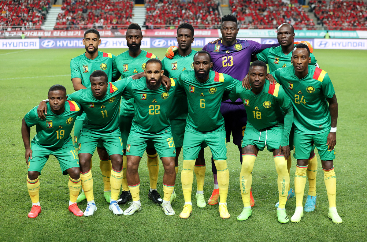 Cameroon players pose for a team group photo before a friendly match against South Korea, in this September 27 file photo. REUTERS
