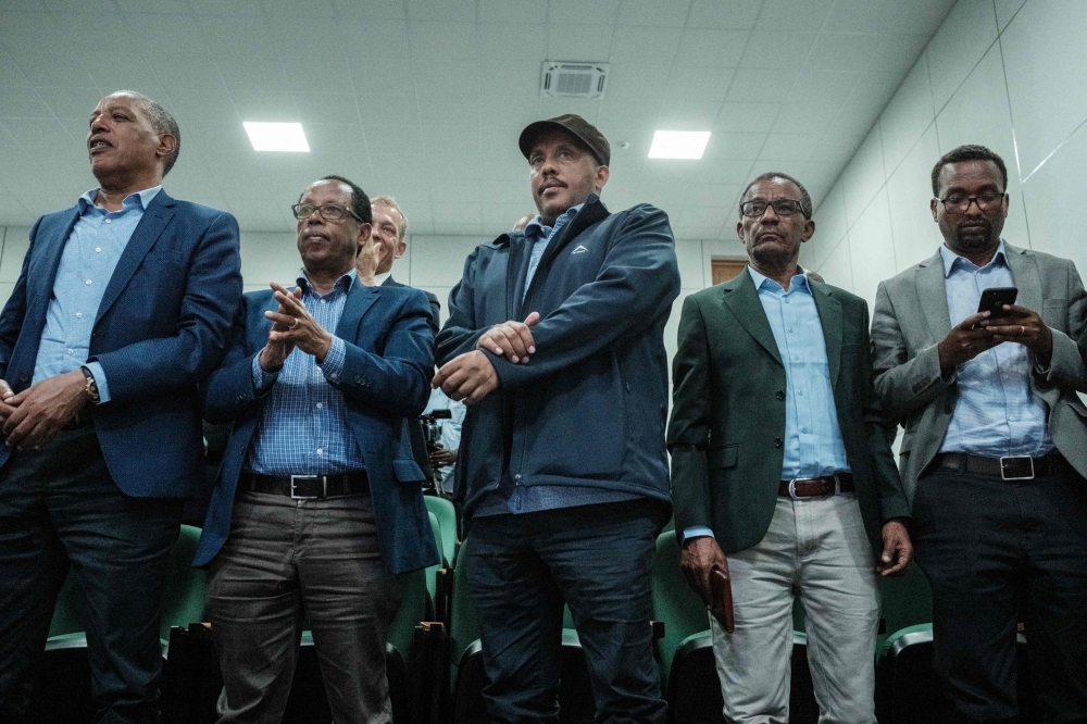 Getachew Reda (centre), the advisor to the President of Tigray Region and the spokesperson of the Tigray People's Liberation Front (TPLF), listens during the signing ceremony of the declaration of the senior commanders meeting on the implementation of the Ethiopia permanent cessation of hostilities agreement between the government of Ethiopia and the Tigray People's Liberation Front (TPLF) in Nairobi on November 12, 2022. (Photo by Yasuyoshi CHIBA / AFP)
 