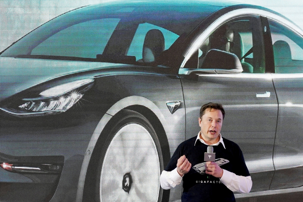 Tesla Inc CEO Elon Musk speaks onstage during a delivery event for Tesla China-made Model 3 cars at its factory in Shanghai, China, January 7, 2020. (REUTERS/Aly Song)