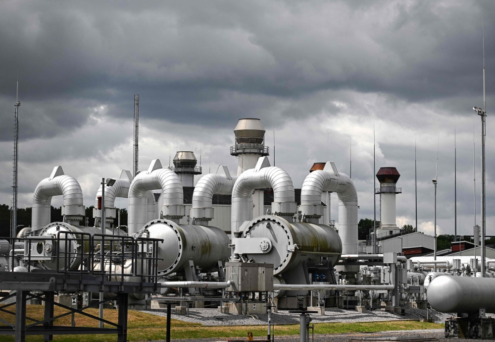 In this file photo taken on July 15, 2022 Pipes and pressure gauges for gas lines are pictured at Open Grid Europe (OGE), one of Europe's largest gas transmission system operators, in Werne, western Germany. - Germany said on November 15, 2022 its gas storage facilities were now completely full, helped by a spell of unseasonably warm weather, as the country readies for a winter deprived of Russian energy. (Photo by Ina FASSBENDER / AFP)