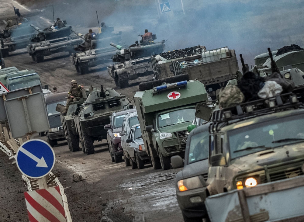 Ukrainian tanks and military vehicles are seen at a road, as Russia's attack on Ukraine continues, in Kherson region, Ukraine, on November 18, 2022. REUTERS/Viacheslav Ratynskyi