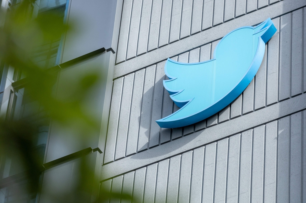 In this file photo taken on October 28, 2022, the Twitter logo outside their headquarters in San Francisco, California. (Photo by Constanza HEVIA / AFP)