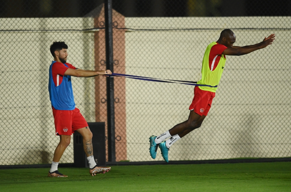 Canada's Jonathan Osorio and Atiba Hutchinson during training session at Umm Salal SC Training Facilities, Qatar, November 20, 2022. (REUTERS/Annegret Hilse)