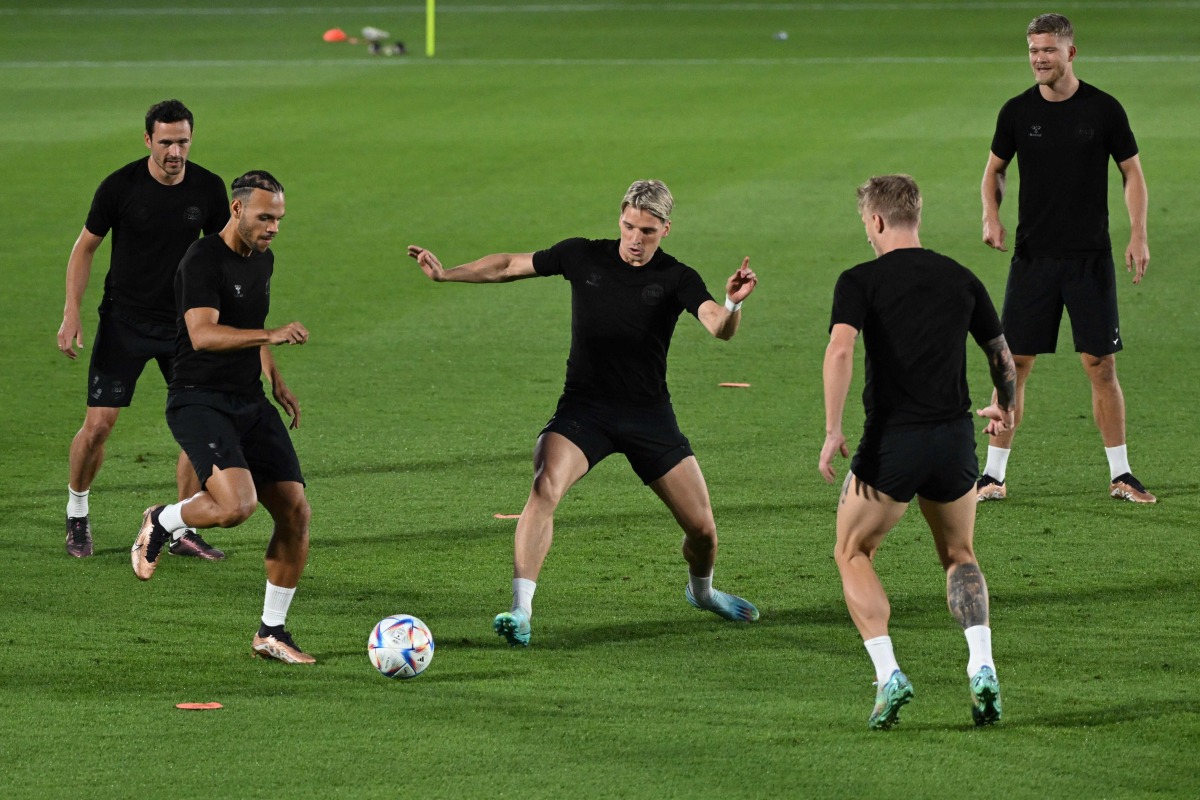 From left: Denmark’s midfielder Thomas Delaney, forward Martin Braithwaite, defender Jens Stryger Larsen, defender Daniel Wass and forward Andreas Cornelius take part in a training session at the Al Sailiya SC Training Site in Doha,  yesterday. AFP