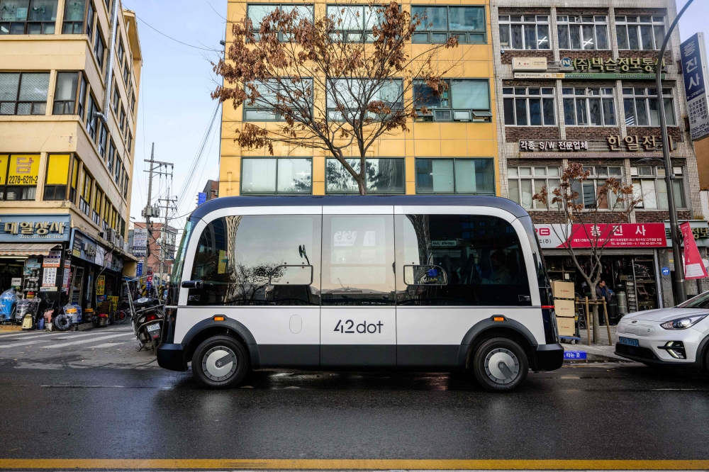 In this photo taken in Seoul on November 23, 2022, a bus is seen parked at one of its two designated stops on the country's first self-driving bus route. Photo by Anthony Wallace / AFP