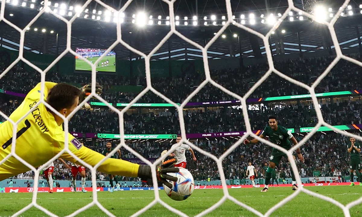 Poland's Wojciech Szczesny saves a penalty from Saudi Arabia's Salim Al Dawsari. File photo.