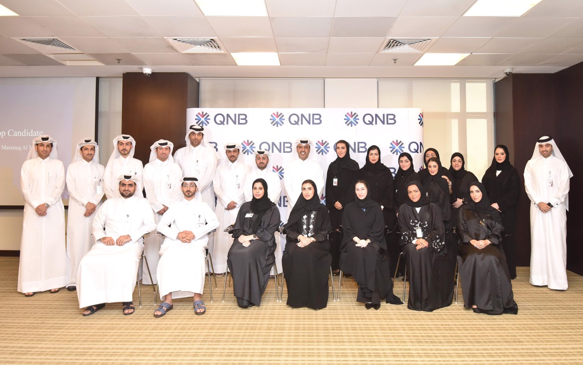 QNB officials pose for a photograph at the Emerging Leaders Program.