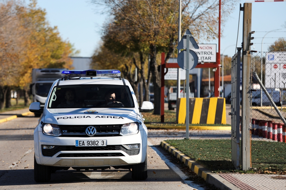 A police vehicle exits the Torrejon de Ardoz Air Force Base after suspected explosive devices hidden in envelopes were mailed to the base. Reuters/Violeta Santos Moura
 