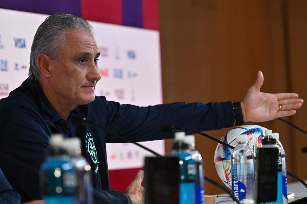 Brazil's coach Tite gives a press conference at the Qatar National Convention Center (QNCC) in Doha on December 1, 2022, on the eve of the Qatar 2022 World Cup football match between Cameroon and Brazil. (Photo by NELSON ALMEIDA / AFP)
