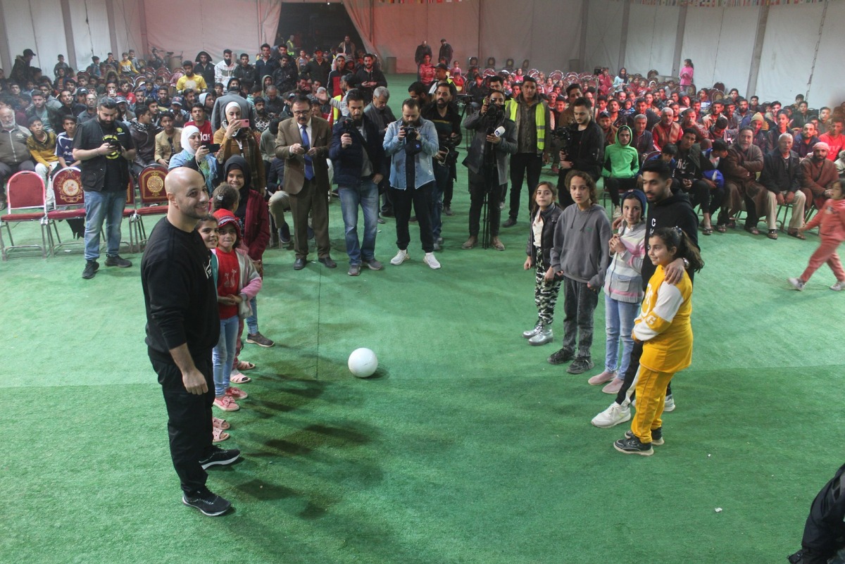 People come together to watch FIFA World Cup Qatar 2022 matches at a fan zone set up at Zaatari camp in Jordan under  #Qatar2022ForAll initiative.