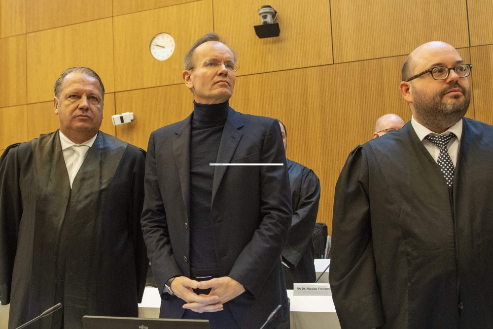 Former Wirecard CEO Markus Braun (center) stands next to his lawyers Alfred Dierlamm (left) and Nico Werning in the courtroom at the District Court in Munich, southern Germany on December 8, 2022. (Photo by Christof STACHE / AFP)