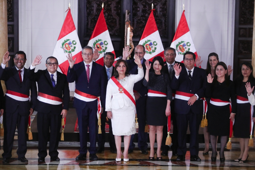 Peru's President Dina Boluarte, who took office after her predecessor Pedro Castillo was ousted, poses for a family photo along with members of her Cabinet in Lima, Peru, on December 10, 2022. REUTERS/Sebastian Castaneda