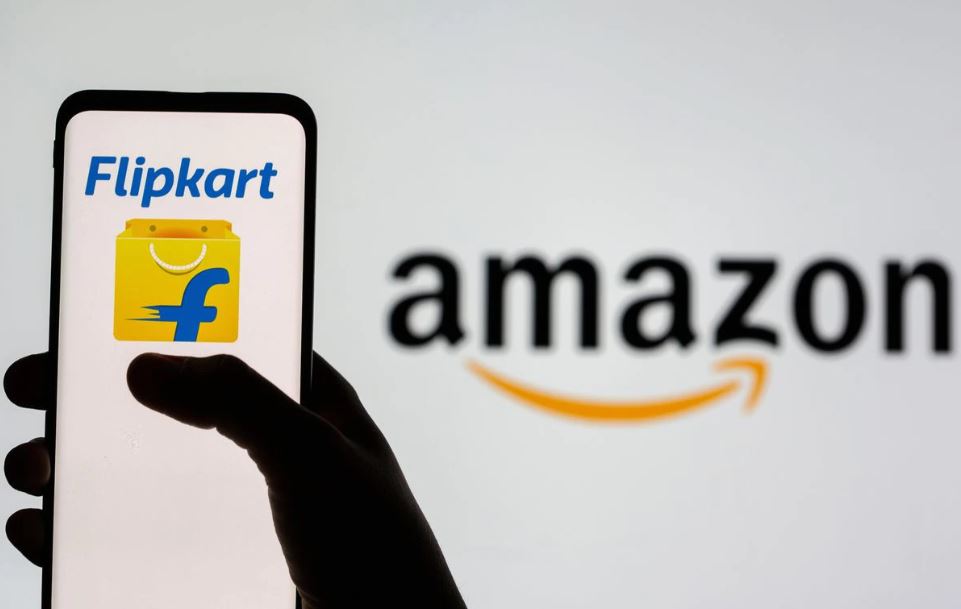 Smartphone with Flipkart logo is seen in front of displayed Amazon logo in this illustration taken July 30, 2021. (REUTERS/Dado Ruvic)