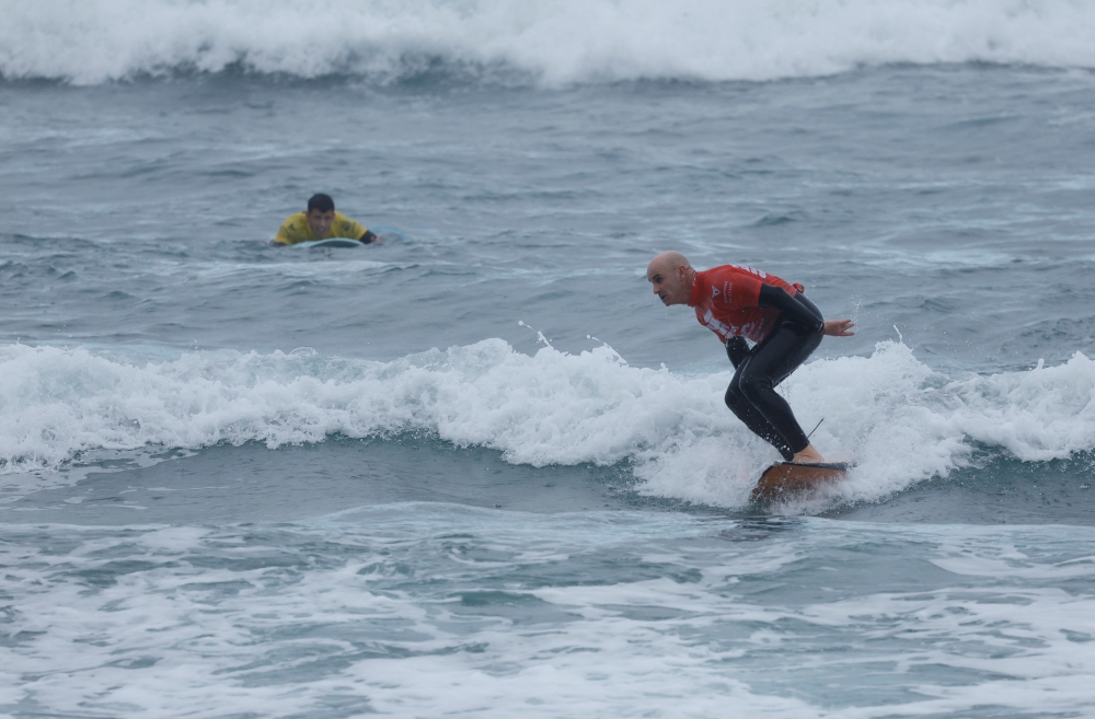 Surfer Aitor Francesena, adapted surfing world champion, who was born with congenital glaucoma, surfs a wave during the adaptive surfing competition, in Las Palmas de Gran Canaria, Spain, December 15, 2022. REUTERS/Borja Suarez