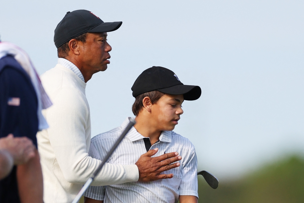 Tiger Woods and Charlie Woods of the United States during the pro-am prior to the PNC Championship at Ritz-Carlton Golf Club in Orlando, Florida, on December 16, 2022. (Mike Ehrmann/Getty Images/AFP)