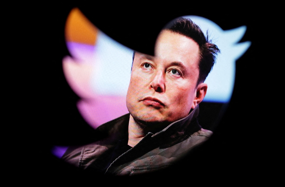 Elon Musk's photo is seen through a Twitter logo in this illustration taken October 28, 2022. Reuters/Dado Ruvic/Illustration/File Photo