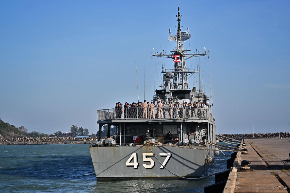 Sailors gather onboard HTMS Kraburi at Bang Saphan Pier in Prachuap Khiri Khan on December 20, 2022, during the search operation for survivors . (Photo by Lillian Suwanrumpha / AFP)