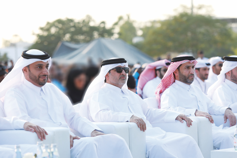 Managing Director and CEO of Qatar Rail, H E Dr. Abdulla bin Abdulaziz bin Turki Al Subaie (center) and Chief of Service Delivery at Qatar Rail, Eng. Abdulla Saif Al Sulaiti (left) with other officials during a ceremony at Al Rayyan Park to celebrate the success of Doha Metro & Lusail Tram’s operational plan for the tournament.