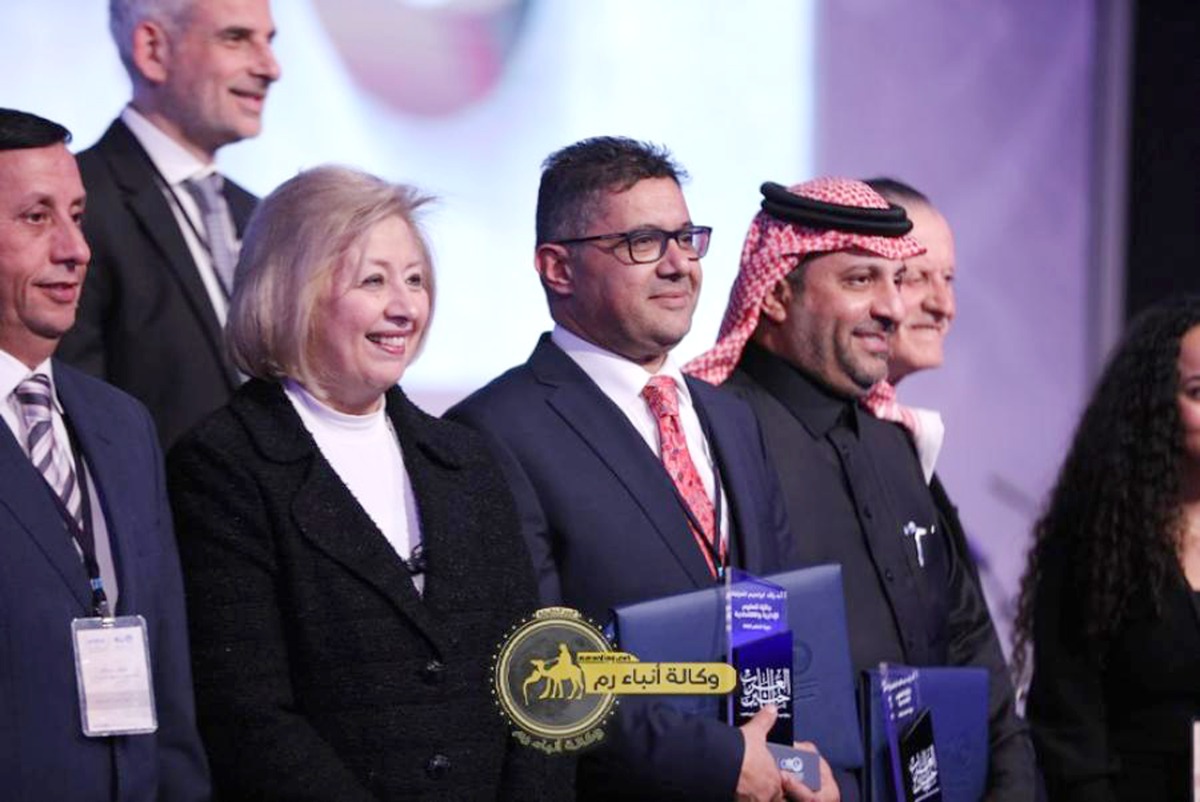 QU Professor Dr. Raed Al Gharabat (fourth left) during the award ceremony.