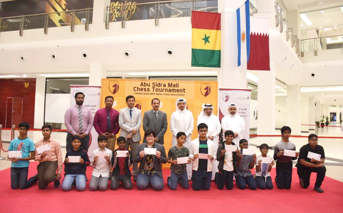 Director of Abu Sidra Mall Haroun Qadri, Qatar Chess Federation (QCF) President Muhammad Al Madhahka and QCF Secretary-General of the Federation Youssef Muhammad Al Mutawa with the award winners at the conclusion of the Abu Sidra Mall Chess Championship.
