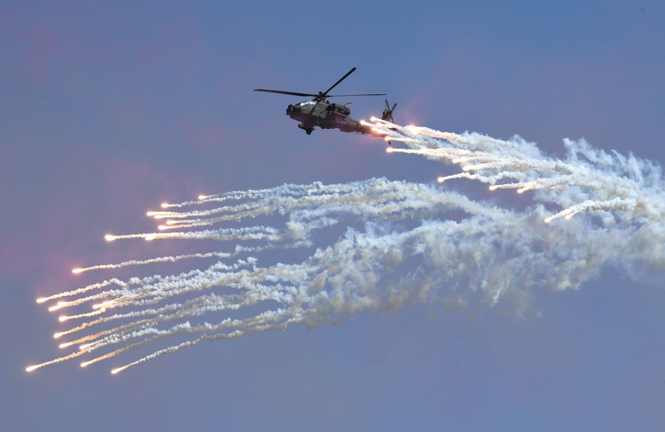 A South Korean Navy Lynx helicopter fires flares during a commemoration ceremony marking South Korea's Armed Forces Day, which will fall on October 1, at the Second Fleet Command of Navy in Pyeongtaek on September 28, 2017. REUTERS/Jung Yeon-Je/Pool
