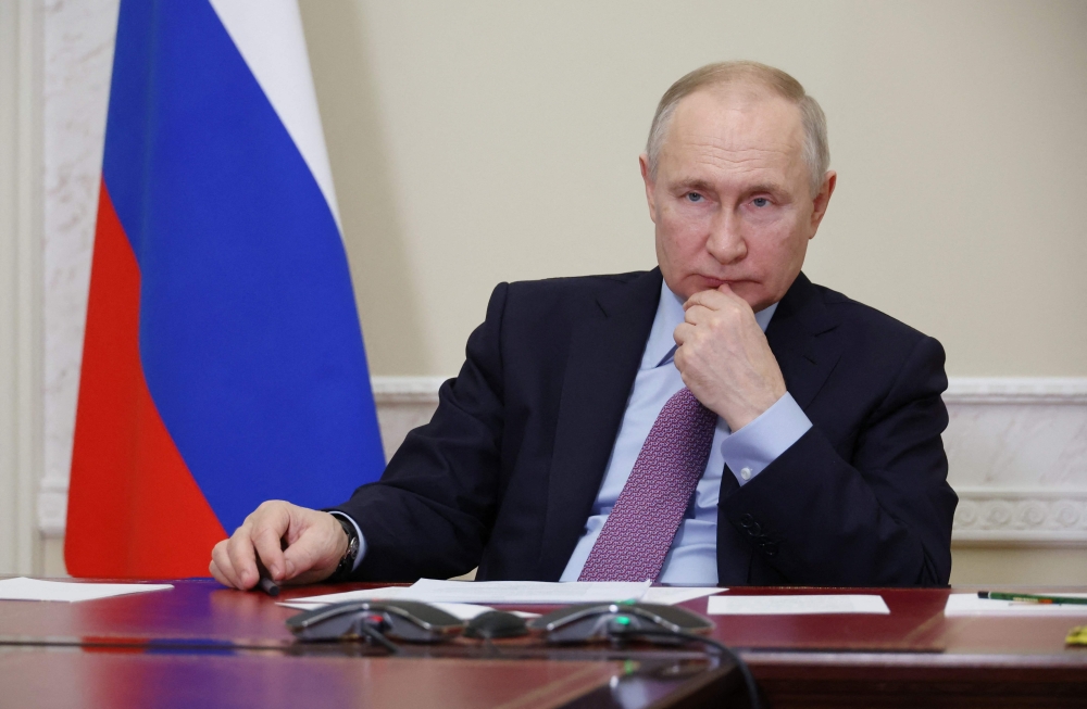 Russian President Vladimir Putin attends a ceremony to launch the Titan-Polymer industrial complex in Pskov region, via a video conference in Staint Petersburg on December 28, 2022. (Photo by Mikhail Klimentyev / SPUTNIK / AFP) 