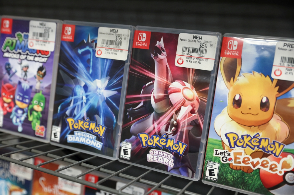 Pokemon games are seen on sale in a GameStop in Manhattan, New York, U.S., December 7, 2021. REUTERS/Andrew Kelly/File Photo