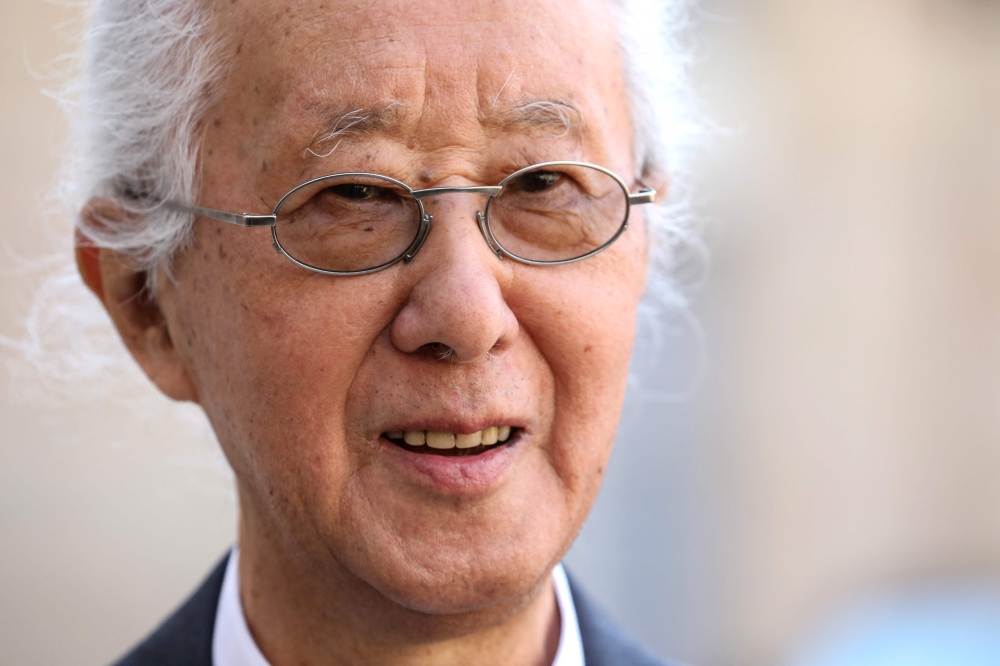 In this file photo taken on May 24, 2019 Japanese architect Arata Isozaki, who was awarded the Pritzker Prize, poses for photographs at the Elysee Palace in Paris where he attended the 2019 Pritzker Architecture Prize reception. Photo by Ludovic MARIN / AFP