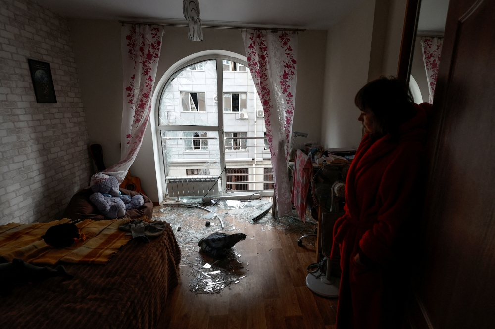 File Photo: Local resident Kateryna stands inside a room of her apartment damaged by a Russian drone strike, amid Russia's attack on Ukraine, in Kyiv, Ukraine December 30, 2022. REUTERS/Valentyn Ogirenko
