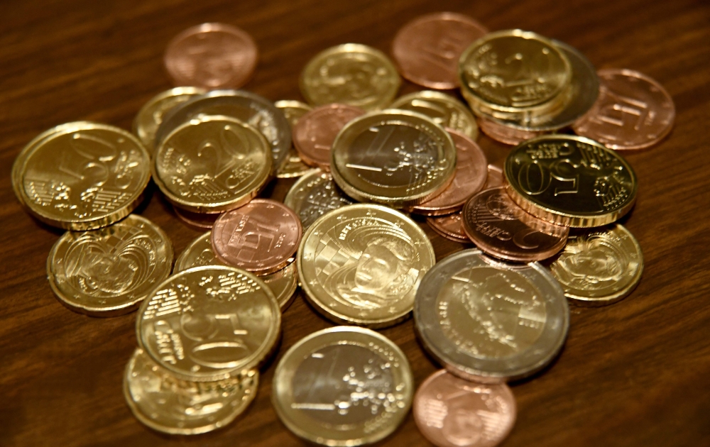 A photograph shows euro coins in Zagreb on December 30, 2022. - On January 1, 2023 the Euro will become the official currency in Croatia. (Photo by Denis LOVROVIC / AFP)