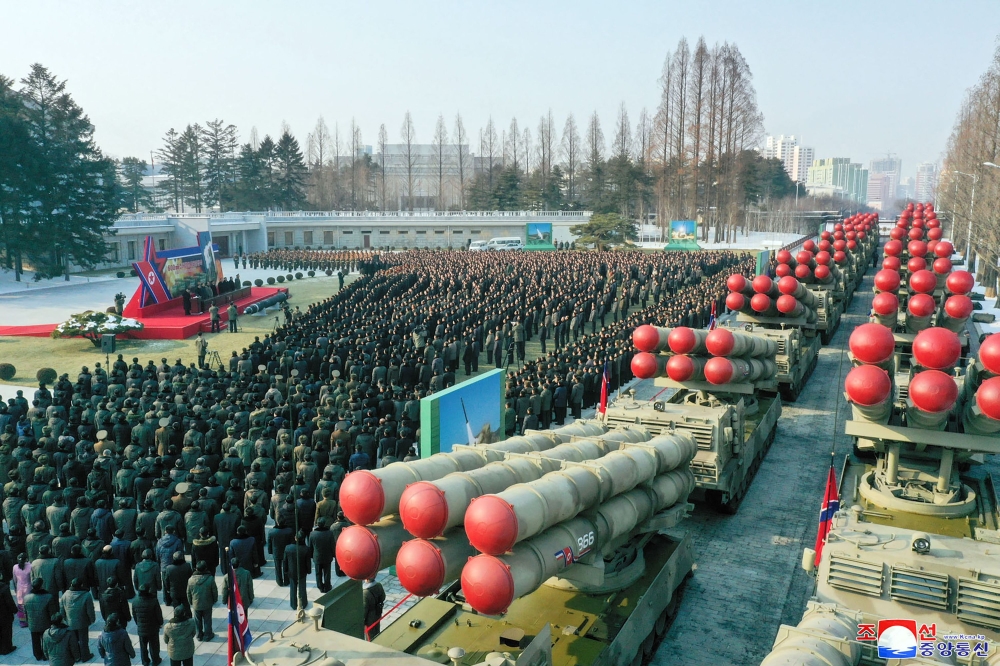 This picture taken on December 31, 2022 and released from North Korea's official Korean Central News Agency (KCNA) on January 1, 2023 shows a ceremony of donating 600mm Super-large Multiple Launch Rocket System in the yard of the headquarters of the Centr