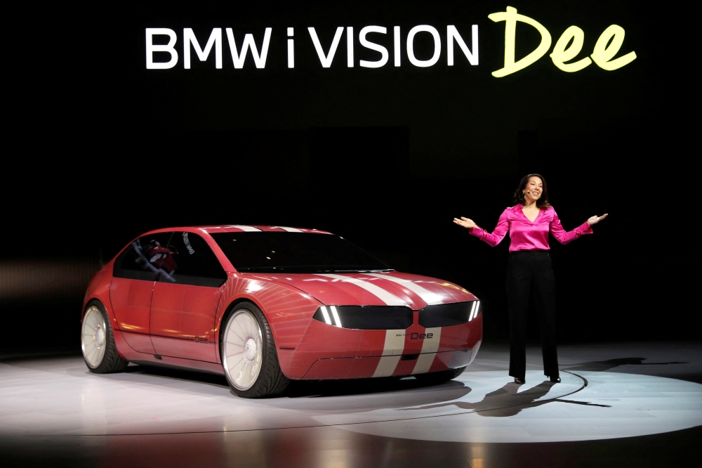 Stella Clarke, the project lead behind BMW’s E-ink color-changing cars, poses with the BMW i Vision Dee (Digital Emotional Experience) concept car during a BMW keynote address at CES 2023, an annual consumer electronics trade show, in Las Vegas, Nevada, US, January 4, 2023. (REUTERS/Steve Marcus)