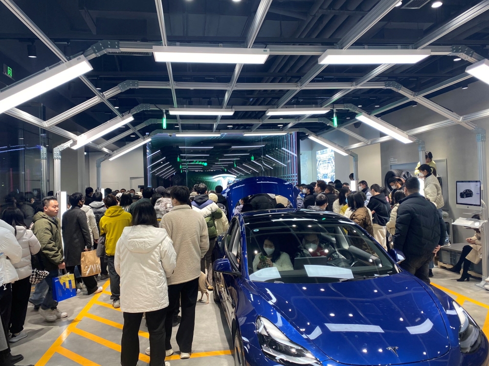 People protest at a Tesla showroom in Chengdu, Sichuan, China, released January 6, 2023 in this picture obtained by Reuters from social media. /via REUTERS 