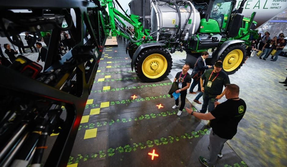 The new sprayers developed by agricultural giant John Deere, and displayed at the 2023 CES technology show in Las Vegas, Nevada, apply pesticides only where their cameras have detected weeds. (Patrick T. Fallon / AFP)