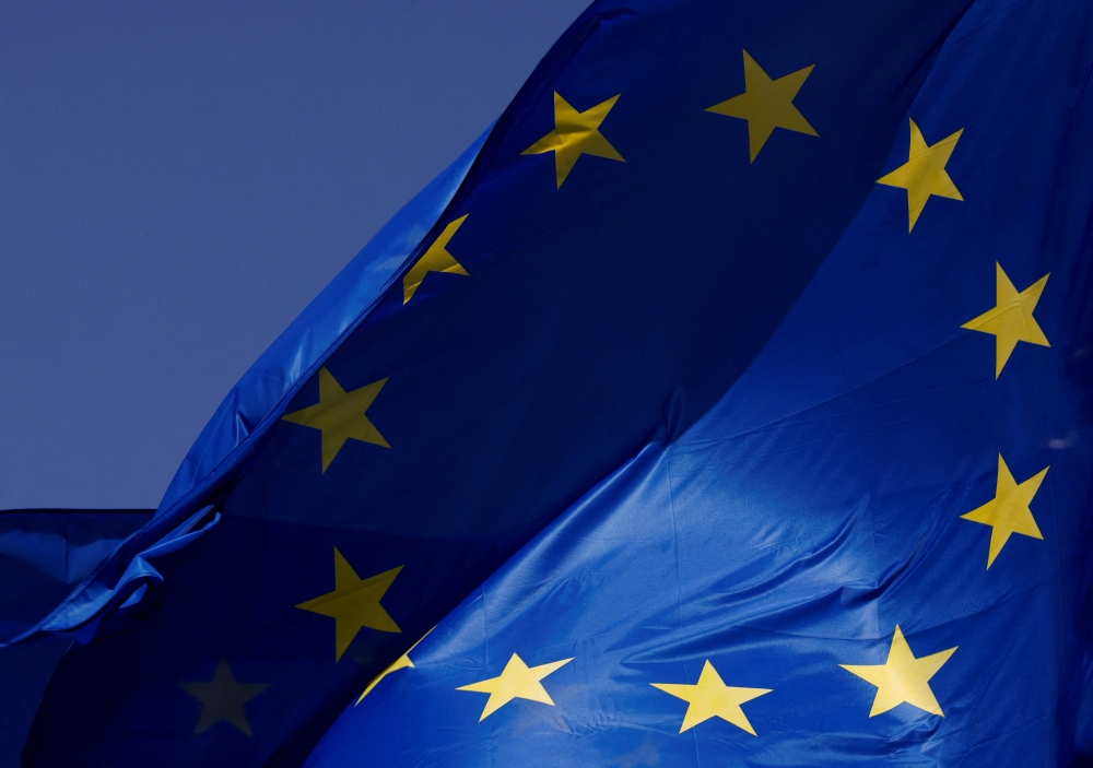 European Union flags flutter outside the EU Commission headquarters in Brussels, Belgium June 17, 2022. (REUTERS/Yves Herman)