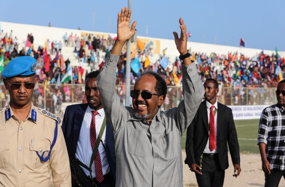 Somalia's President Hassan Sheikh Mohamud (centre) gestures as he attends a rally against the Al-Shabaab jihadist group in Mogadishu on January 12, 2023. (Photo by Hassan Ali Elmi / AFP)
