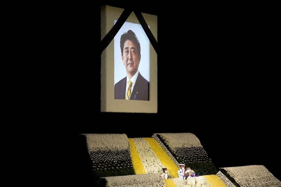 The portrait of former Japanese Prime Minister Shinzo Abe is seen at the altar during his state funeral at Nippon Budokan, in Tokyo, Japan, September, 27, 2022. Eugene Hoshiko/Pool via REUTERS/File Photo
