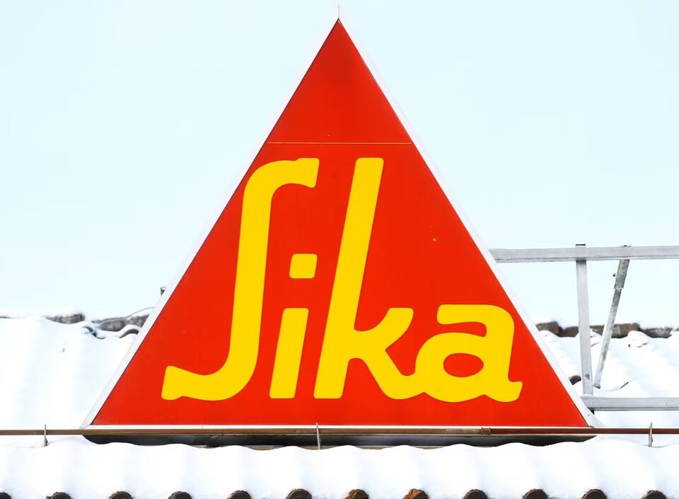 Logo of Swiss chemical group Sika is seen on a snow-covered roof of a branch in Berikon, Switzerland on February 12, 2021. File Photo / Reuters

