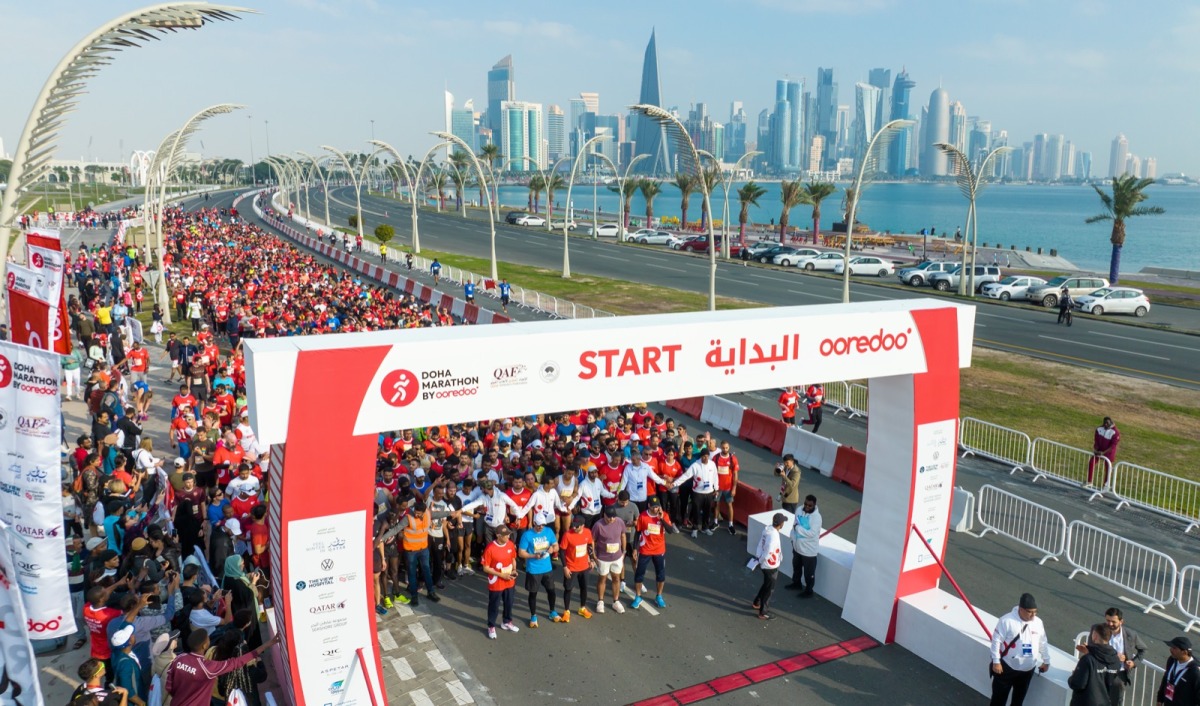 Runners stand at the start line for 2023 Doha Marathon by Ooredoo yesterday. 