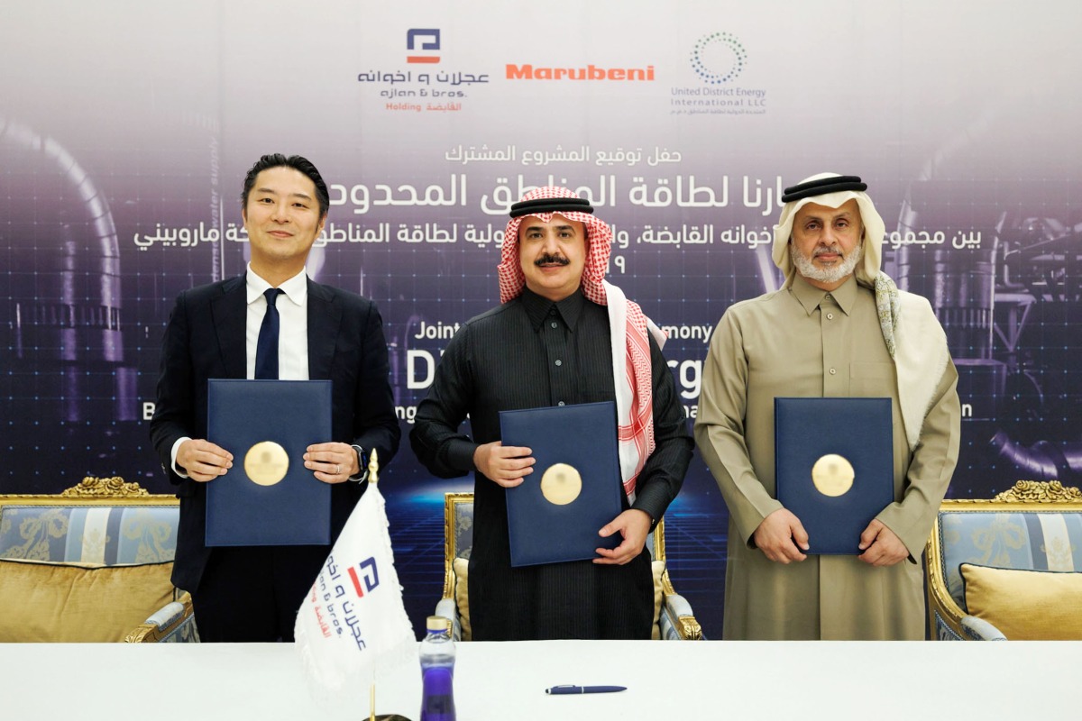 Officials of UDEI, Ajlan & Bros Holding at the signing ceremony.