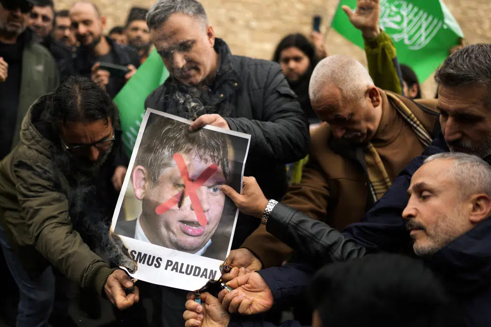 People set on fire a photograph of far right activist Rasmus Paludan during a protest outside the Swedish consulate in Istanbul, Turkey, Sunday, Jan 22, 2023. File Photo: Francisco Seco/AP

