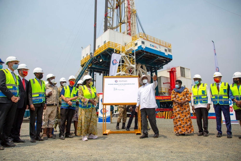 Ugandan President Yoweri Museveni (centre-left) alongside other local and government leaders launch the Kingfisher oil field in Kikuube district on January 24, 2023. (Photo by Stuart Tibaweswa / AFP)