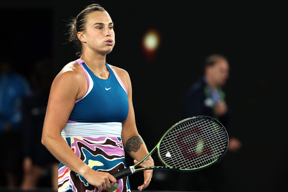 Belarus' Aryna Sabalenka celebrates victory against Poland's Magda Linette after the women's singles semi-final match on day eleven of the Australian Open tennis tournament in Melbourne on January 26, 2023. (Photo by Martin KEEP / AFP)