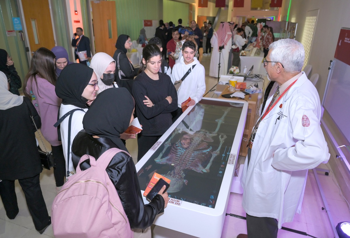 WCM-Q faculty offering a demonstration to high school students during WCM-Q’s Medicine Unlimited fair.