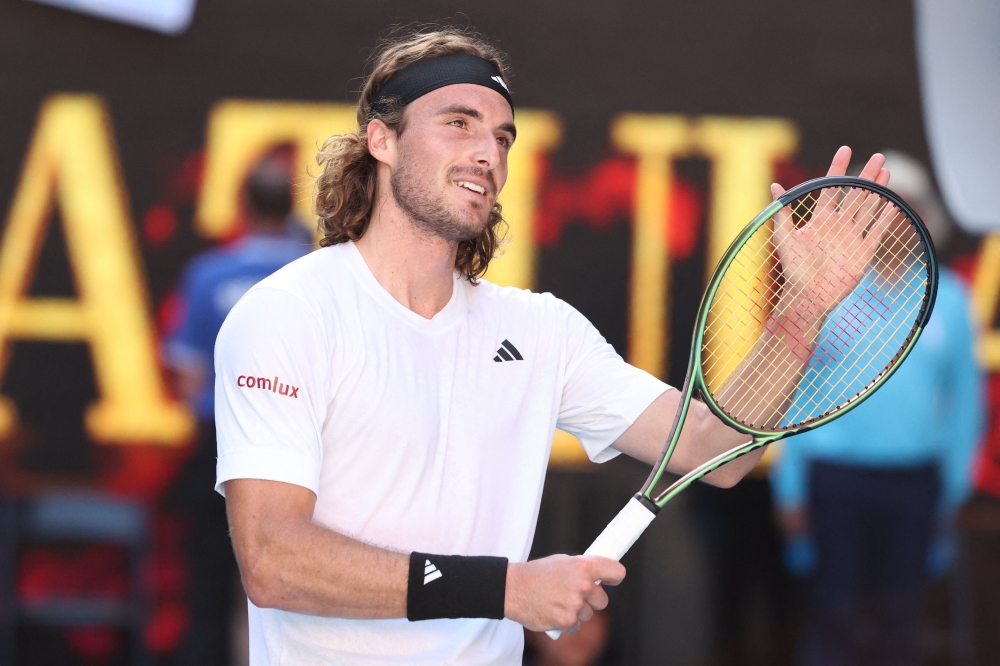 Greece's Stefanos Tsitsipas celebrates after victory against Russia's Karen Khachanov during their men's singles semi-final match on day twelve of the Australian Open tennis tournament in Melbourne on January 27, 2023. (Photo by Martin KEEP / AFP)