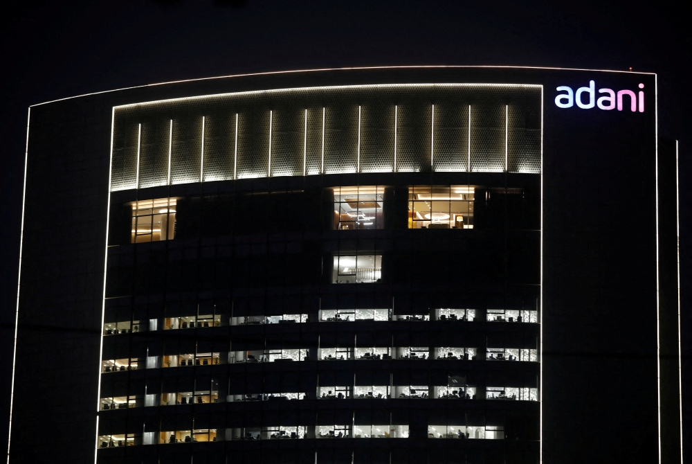 The logo of the Adani Group is seen on the facade of its Corporate House on the outskirts of Ahmedabad, India, on January 27, 2023. REUTERS/Amit Dave/File Photo