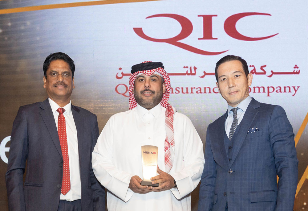 An official of Qatar Insurance Company receives the Insurer of the year in Qatar award at the MENA IR Awards 2023.