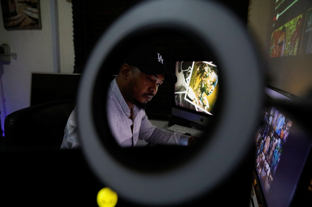 Nigerian artist Malik Afegbua creates hyper-realistic pictures of African elderly people, using artificial intelligence, at his home in Lagos, Nigeria January 25, 2023. REUTERS/Temilade Adelaja

