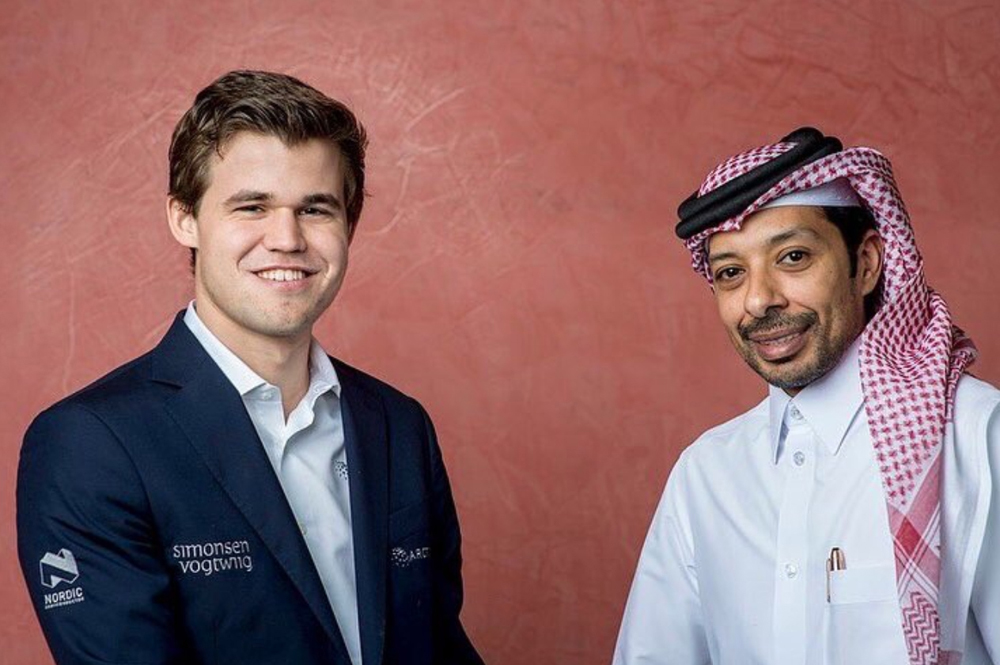 QCF President Mohammed Al Madhahka with Norway’s Magnus Carlsen. 